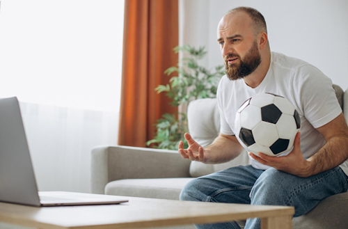 https://www.freepik.com/free-photo/man-holding-football-ball-watching-soccer-online-home_26146284.htm#fromView=search&page=1&position=5&uuid=dc35cd05-fb3c-4da5-966d-fbb179e63b4c&query=Top+mistakes+in+sports+betting+and+how+to+avoid+them